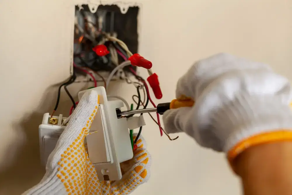 Electrician inspecting residential wiring
